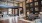 a room with a large black wall and a large wood floor