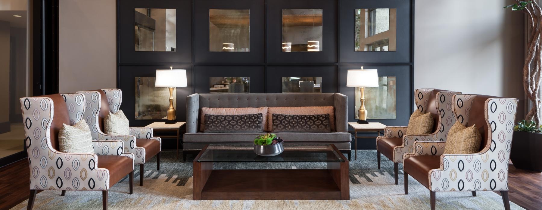 a living room with a couch and chairs