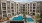 a large building with a pool