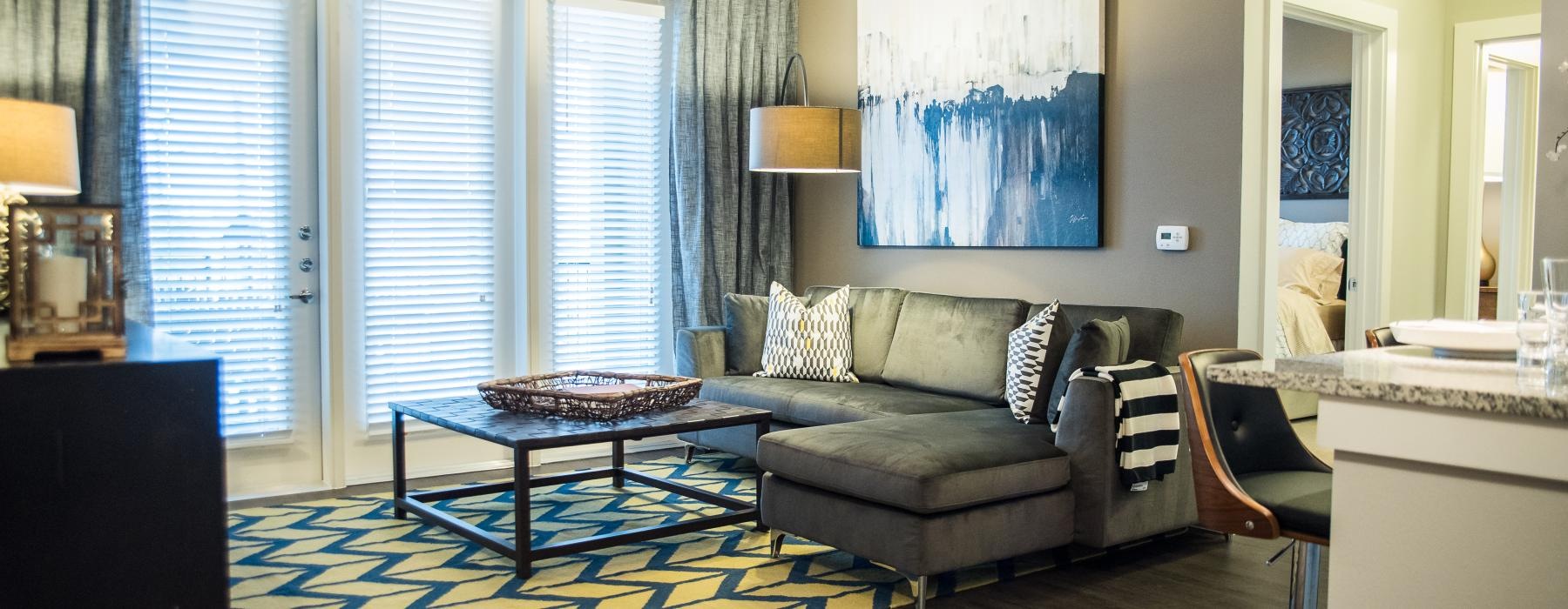 a living room with a couch and a table