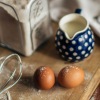 eggs and whisk on a cutting board