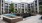 a large building with a pool in front of it