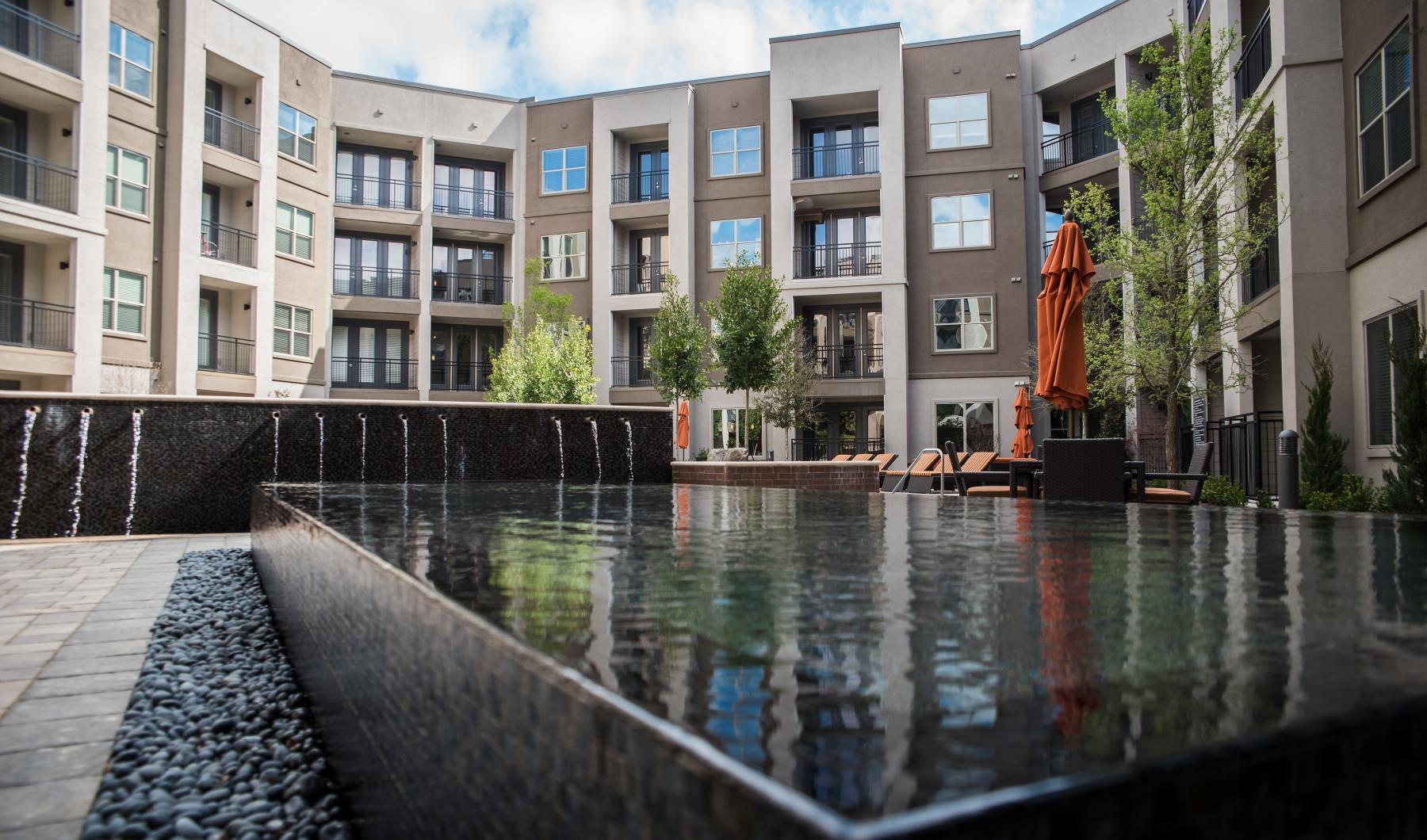 a building with a pool in front